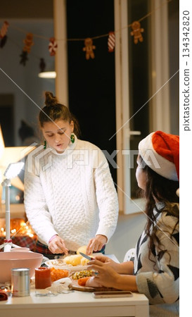 Kitchen scene of holiday baking and warm gathering atmosphere Kitchen scene of holiday baking and warm gathering atmosphere 134342820