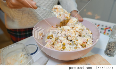 Refreshing potato and ham salad in glowing candle ambiance 134342823