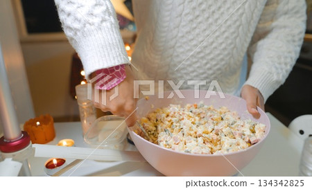 Festive holiday gathering featuring beautifully arranged potato ham salad 134342825