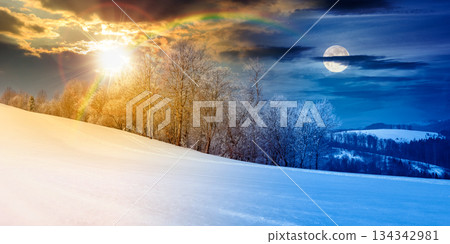 panorama of a beautiful landscape on winter solstice. day and night time change concept. forest on a snow covered meadow with sun and moon at twilight. duality and transition template panorama of a beautiful landscape on winter solstice. day and night time change concept. forest on a snow covered meadow with sun and moon at twilight. duality and transition template 134342981