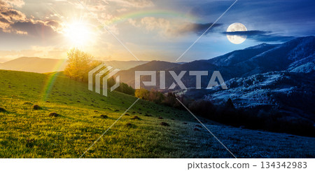 countryside scenery in mountains. day and night time change concept. beautiful landscape with meadows rolling through forested hills with sun and moon. equality and shift template for spring equinox 134342983