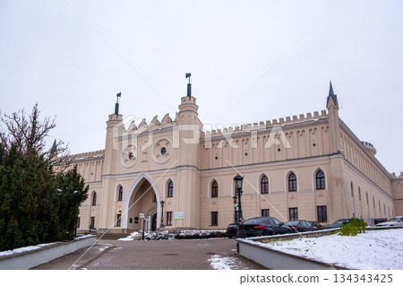 Lublin castle with towers and snow on the ground during winter season 134343425