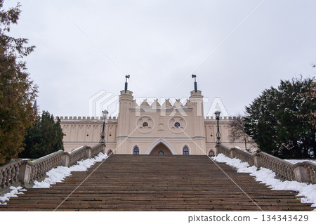 Front of the historic castle in Lublin in winter scene with snow and cloudy sky Front of the historic castle in Lublin in winter scene with snow and cloudy sky 134343429