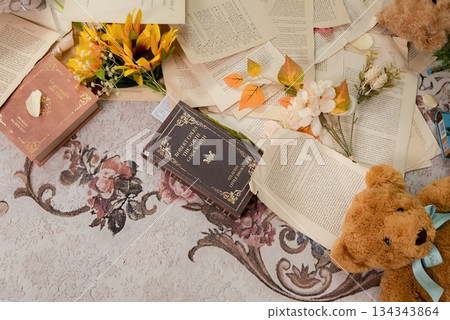 Romantic table photo of a teddy bear and antique pieces of paper 134343864