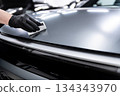 Ceramic coating application on matte car paint surface during professional car detailing process 134343970