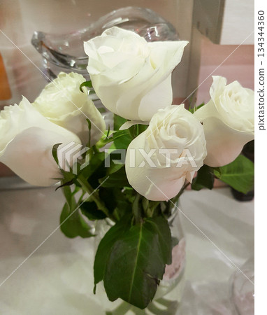 Bouquet of white roses in vase close up soft petals vertical Bouquet of white roses in vase close up soft petals vertical 134344360