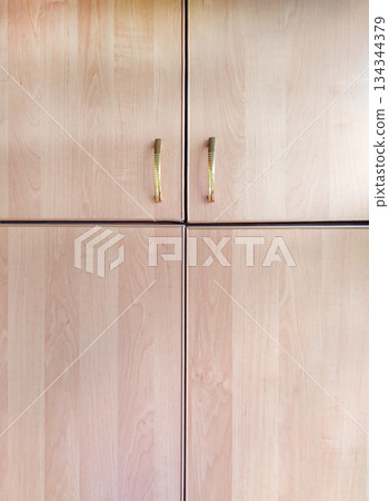 Wood cabinet doors with gold handles symmetry vertical Wood cabinet doors with gold handles symmetry vertical 134344379