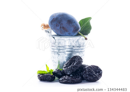 Delicious ripe plums and antioxidant rich dried prunes Delicious ripe plums and antioxidant rich dried prunes 134344483