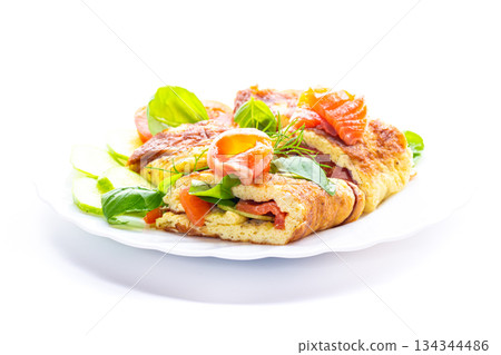 Egg omelet with salmon and spinach leaves for breakfast Egg omelet with salmon and spinach leaves for breakfast 134344486