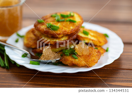 Golden fried potato pancakes for rustic comfort meal 134344531