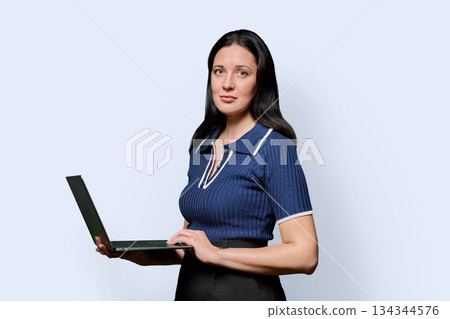 Portrait of successful middle-aged woman with laptop on white background 134344576