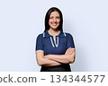Portrait of beautiful smiling 40 years old woman posing on white background 134344577