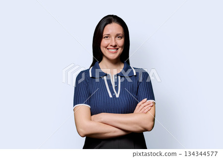 Portrait of beautiful smiling 40 years old woman posing on white background Portrait of beautiful smiling 40 years old woman posing on white background 134344577
