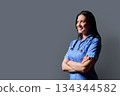 Profile portrait of confident middle-aged woman doctor, nurse on grey background 134344582