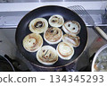 Photo of browned onions fried in a frying pan 134345293