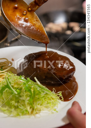 Close-up of a hamburger steak with demi-glace sauce 134345565