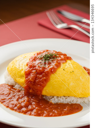 Japanese Omurice with Tomato Sauce on White Plate 134346695