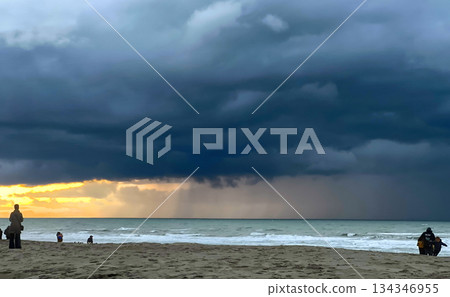 Nieuwpoort, West-Vlaanderen, Belgium, Ocotber 25th, 2025, Solitary figure gazes at encroaching storm Nieuwpoort, West-Vlaanderen, Belgium, Ocotber 25th, 2025, Solitary figure gazes at encroaching storm 134346955