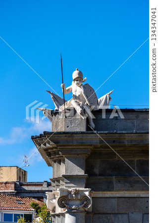 Cherub sculpture on top of Puerta de Alcala arch in Madrid Cherub sculpture on top of Puerta de Alcala arch in Madrid 134347041