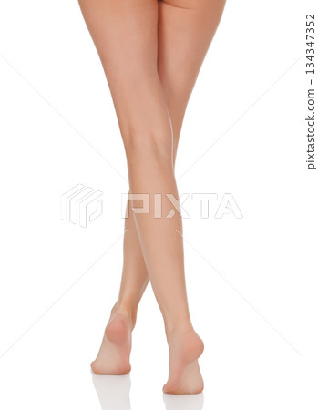 Female legs with pink heels isolated on white background Female legs with pink heels isolated on white background 134347352