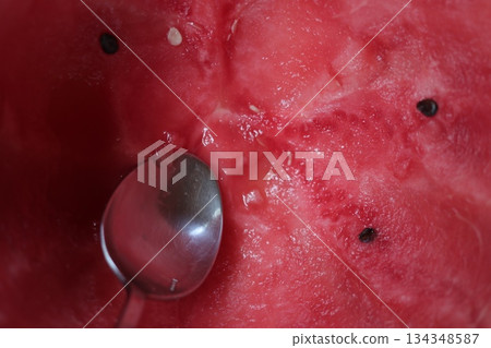 Watermelon background with a silver spoon. Watermelon background with a silver spoon. 134348587