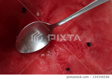 Watermelon background with a silver spoon. Watermelon background with a silver spoon. 134348588