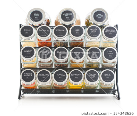 Assorted spices in glass jars with metal lids 134348626