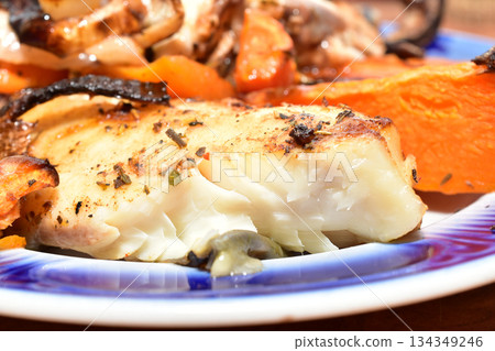 Fried pieces of fish with vegetables. Fried pieces of fish with vegetables. 134349246