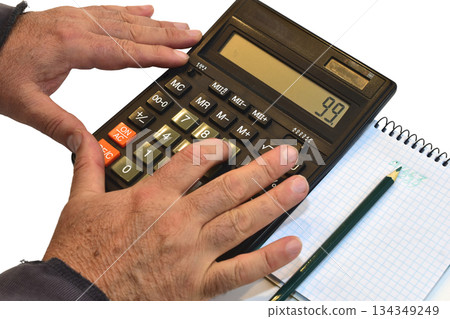 Men's hands pressing keys on a calculator. Men's hands pressing keys on a calculator. 134349249