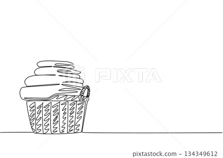 Continuous one line drawing pile of white towels of various sizes in a wicker basket. A collection of towels is ready to be used by guests. Towel Day. Single line draw design vector illustration 134349612