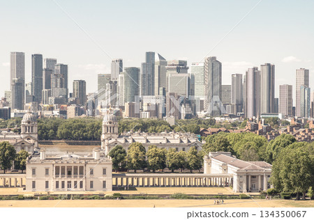 the iconic Queen's House and the Old Royal Naval College in the foreground, with the modern skyscrapers of Canary Wharf forming the distinctive skyline in the background. 134350067