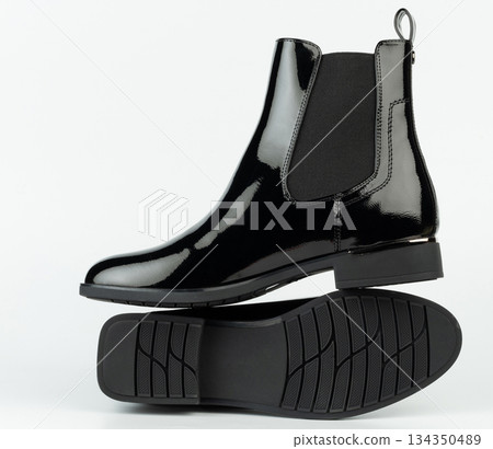 Black leather boots on white background for online retail display Black leather boots on white background for online retail display 134350489