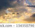 dramatic sunset sky with clouds. beautiful nature background in golden evening light. telephoto shot. leadership corporate wallpaper 134350790