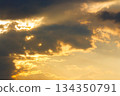 dramatic sunset sky with clouds. beautiful nature background in golden evening light. telephoto shot. leadership corporate wallpaper 134350791