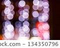 christmas tree bokeh lights. new year abstract background. decorated festive winter holiday backdrop. de focused urban landscape of uzhhorod dark street in glowing december garlands 134350796