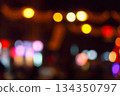 christmas tree bokeh lights. new year abstract background. decorated festive winter holiday backdrop. de focused urban landscape of uzhhorod dark street in glowing december garlands 134350797