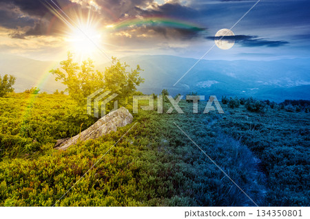 hiking trail through mountain landscape. day and night time change concept. mountains under sky with sun and moon at twilight. scenery with green grass and rolling hills. equality and shift template 134350801