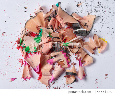Close-up of a pile of spiral shavings from sharpening colored pencils on a white background Close-up of a pile of spiral shavings from sharpening colored pencils on a white background 134351220