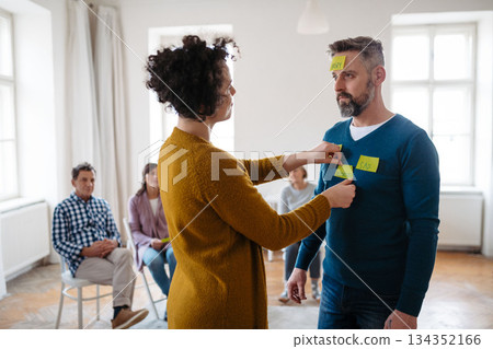 Participants labeling feelings during therapeutic workshop. Participants labeling feelings during therapeutic workshop. 134352166