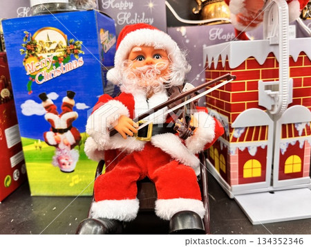 Santa Claus's New Year's toy in a red suit. High quality photo Santa Claus's New Year's toy in a red suit. High quality photo 134352346