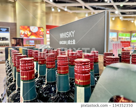 Alcoholic drinks are on the shop window in duty free. High quality photo 134352350