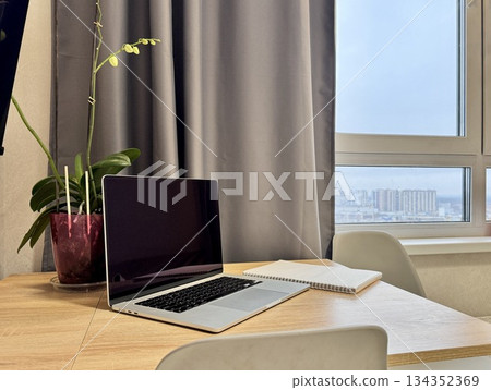 Workplace at home, laptop on the table. High quality photo Workplace at home, laptop on the table. High quality photo 134352369