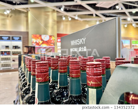 Alcoholic drinks are on the shop window in duty free. High quality photo Alcoholic drinks are on the shop window in duty free. High quality photo 134352372