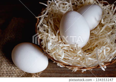 White eggs in rustic scene representing concepts of nourishment and healthy protein food. White eggs in rustic scene representing concepts of nourishment and healthy protein food. 134353147