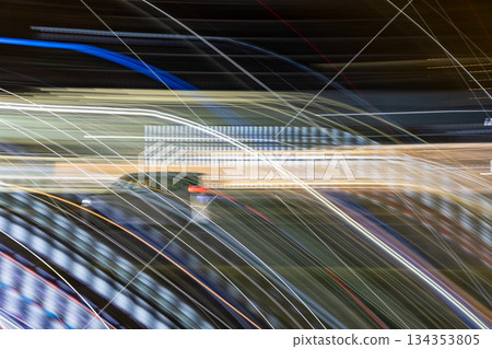 Night road and light trail of a light car 134353805