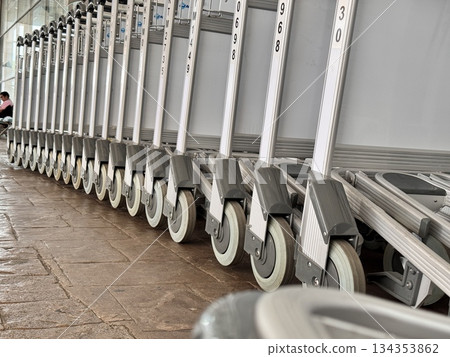 Trolleys for transporting luggage at the airport Trolleys for transporting luggage at the airport 134353862