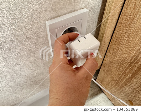 Charging a work laptop, charger Charging a work laptop, charger 134353869