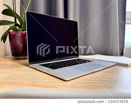 Workplace at home, laptop on the table 134353879