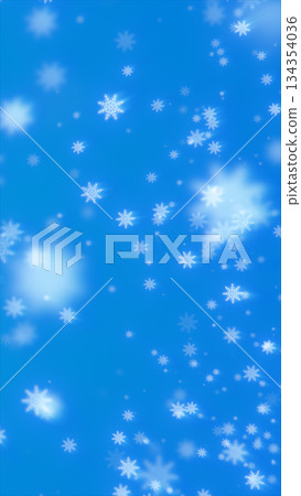 Soft falling white snowflakes drifting across a bright blue winter background 134354036