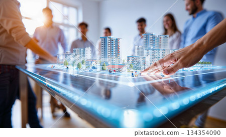 Architects and Developers Reviewing a Futuristic City Model. A group of people, including both men and women, stands around a detailed scale model of a futuristic city.  134354090